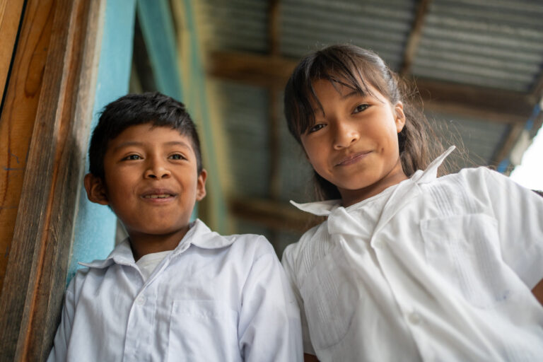 Two children standing together, representing meaningful gifts for kids through World Renew's Giving Guide.